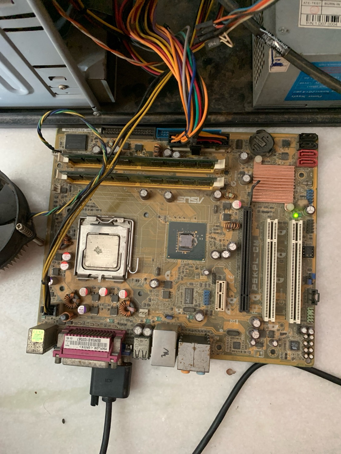A vintage motherboard with socket and PCI slots