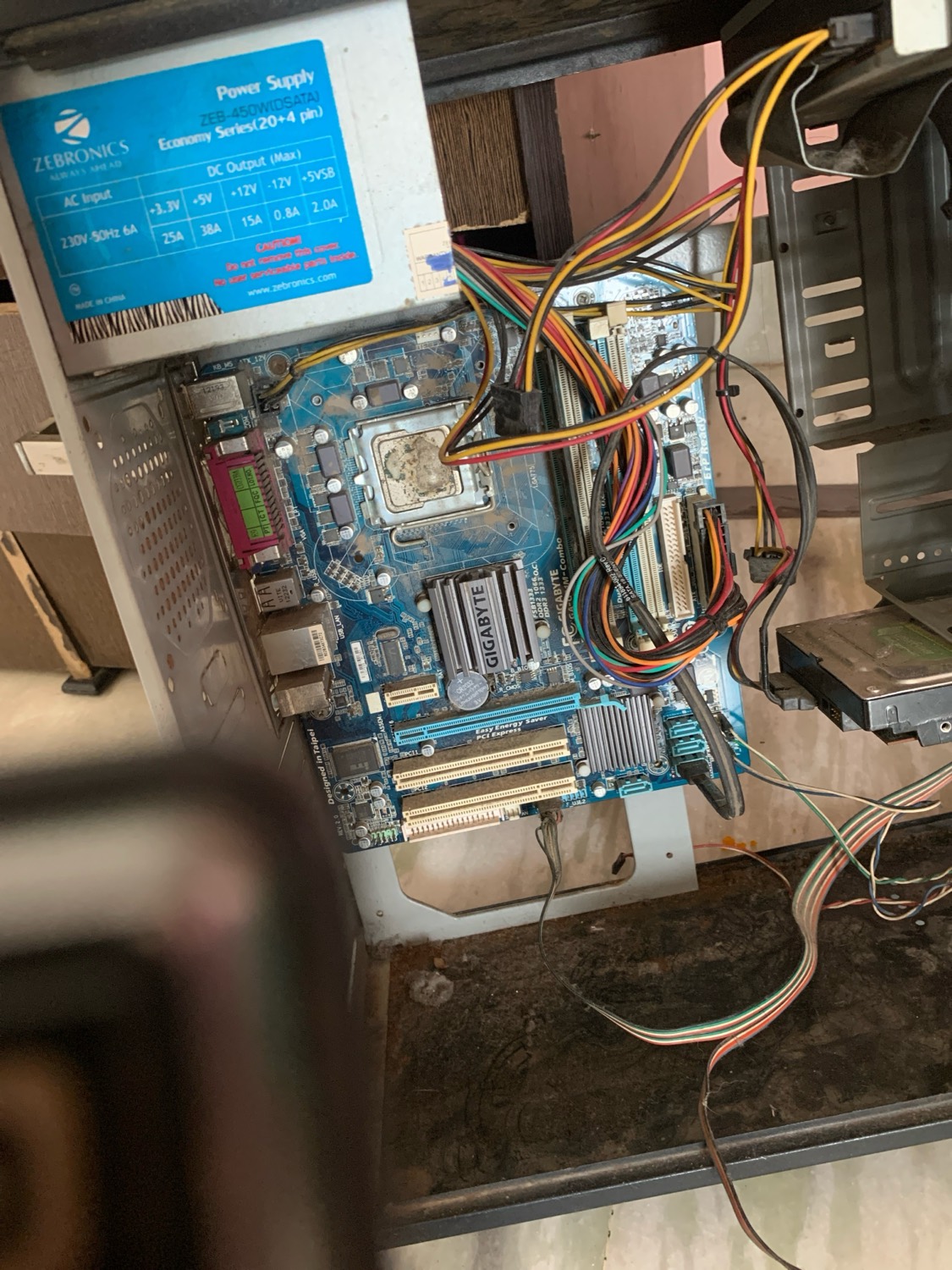 A desktop build with the motherboard and power supply exposed