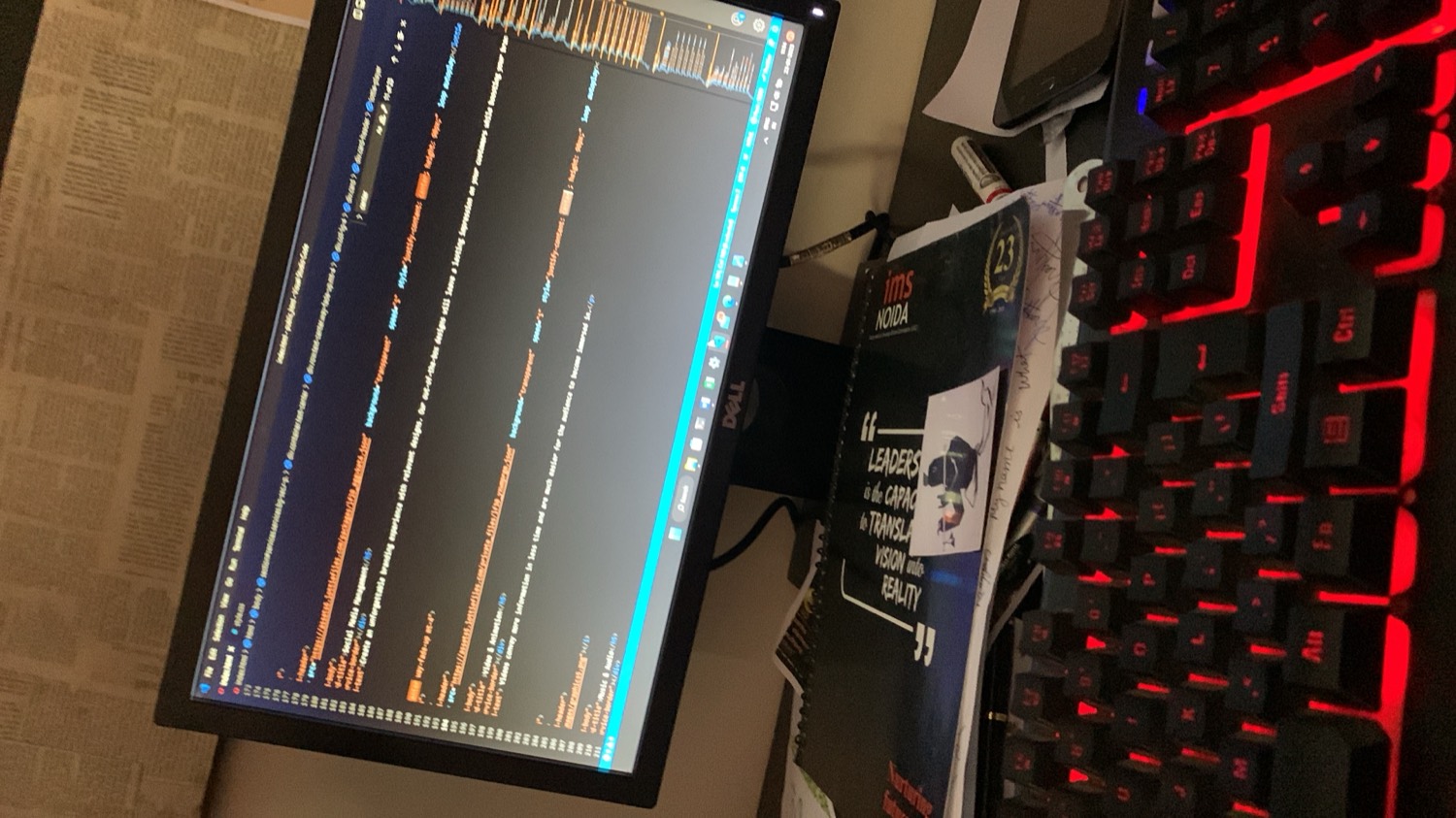 Code editor open on the desktop monitor at night